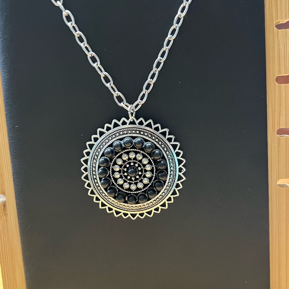 Intricate Silver and Black Pendant Necklace with Filigree Design